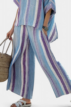 LEIRE — Top elegante en tono malva pastel y pantalones de lino a rayas