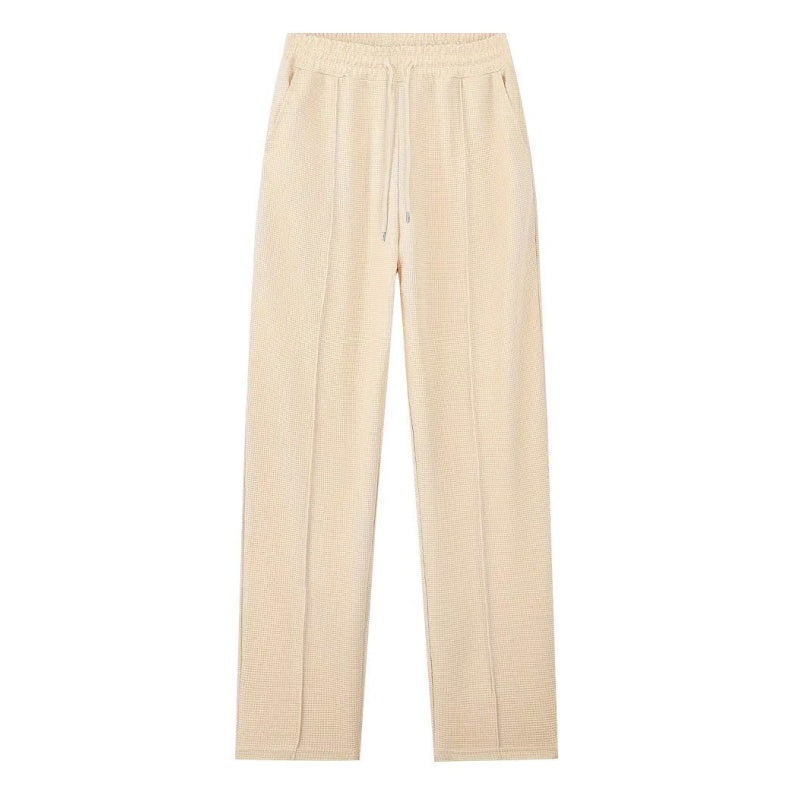 Conjunto compuesto por sudadera con tejido de punto gofrado y pantalones de pierna recta.